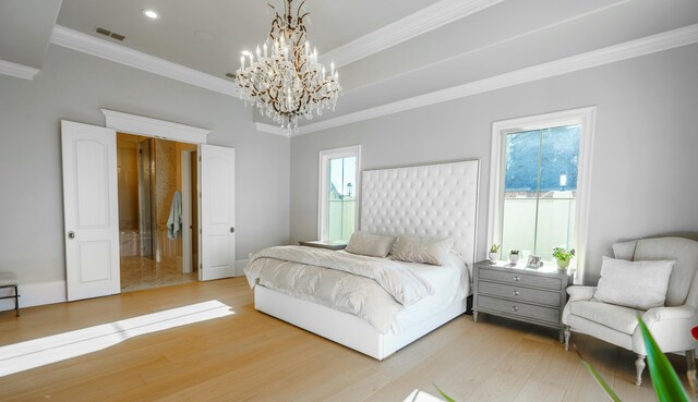 bedroom featuring multiple windows, hardwood / wood-style floors, a notable chandelier, and ornamental molding