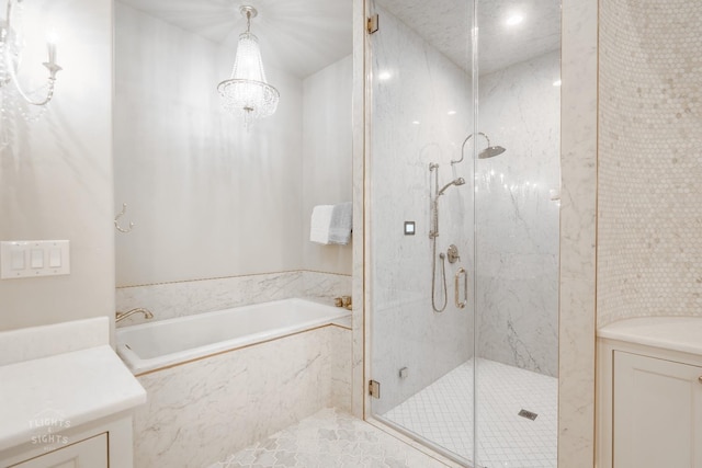 bathroom with vanity and independent shower and bath