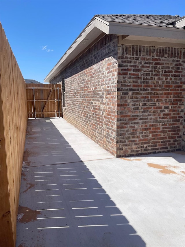 view of side of property featuring a patio