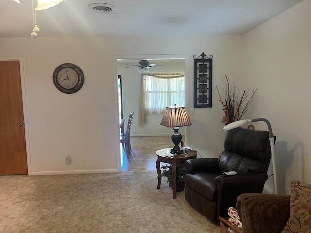 sitting room with light colored carpet