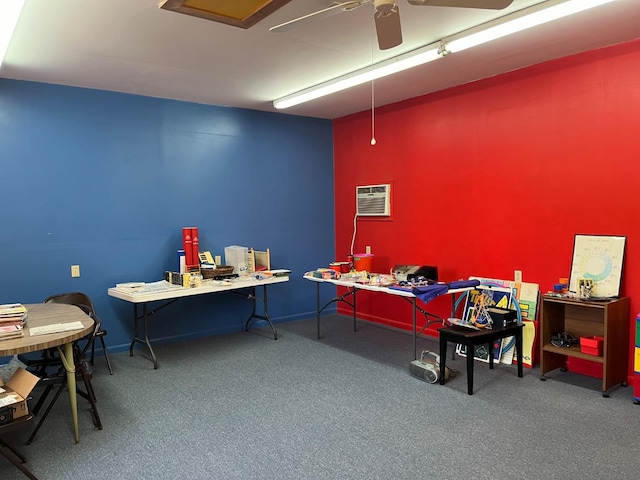 office space with ceiling fan, carpet flooring, and a wall unit AC