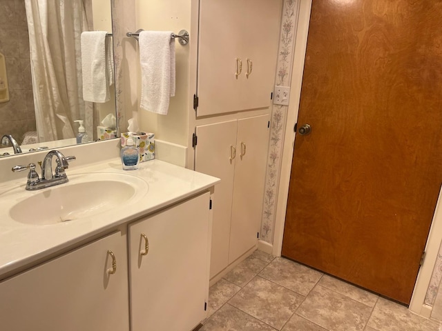 bathroom with vanity and tile patterned floors