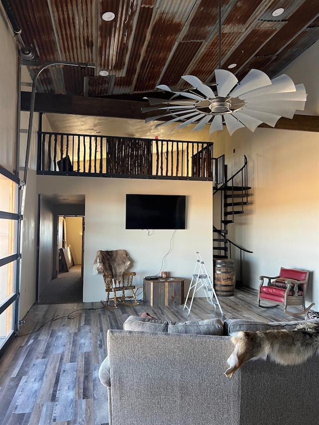 living room featuring hardwood / wood-style flooring and ceiling fan