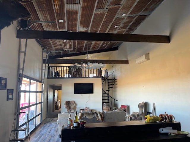 kitchen featuring beamed ceiling, an AC wall unit, hardwood / wood-style flooring, and wood ceiling