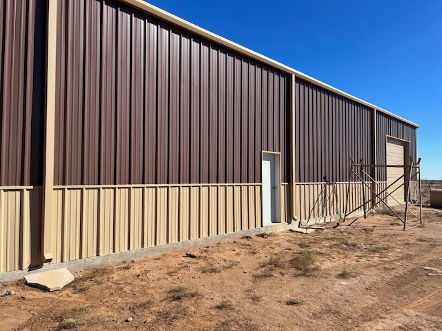 view of home's exterior featuring an outbuilding