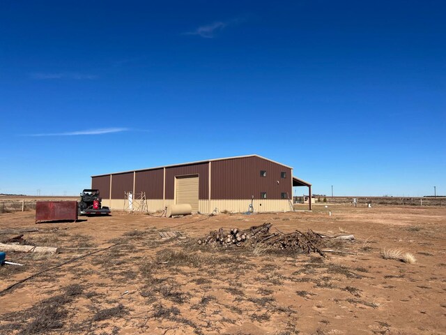 exterior space featuring an outbuilding and a garage