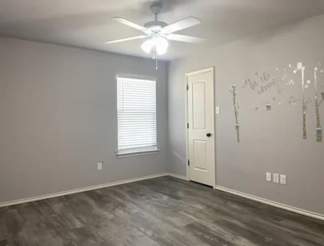 spare room featuring ceiling fan and dark hardwood / wood-style flooring