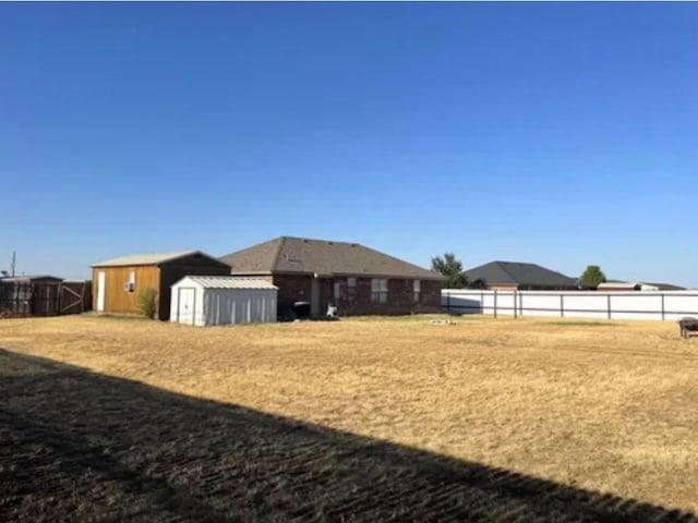 view of yard with a storage unit