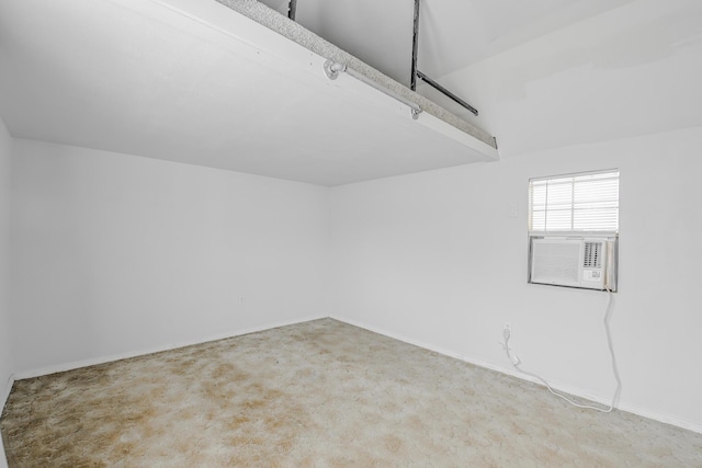 garage with cooling unit and baseboards