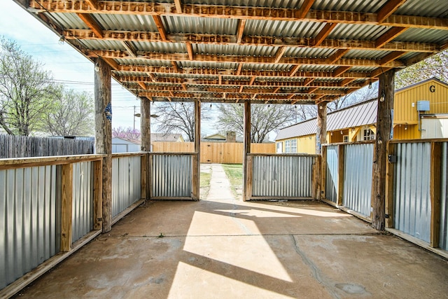 view of patio with an outbuilding