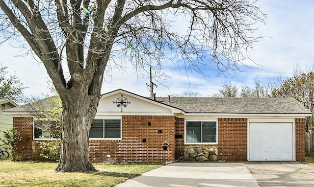 view of front of house featuring a front lawn, brick siding, an attached garage, a shingled roof, and concrete driveway