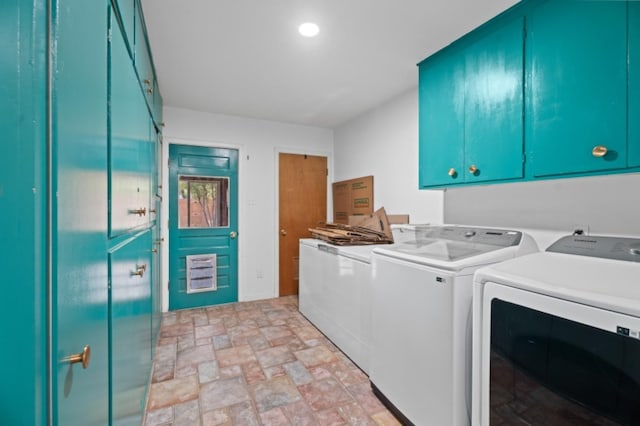 laundry area with cabinets and washing machine and dryer