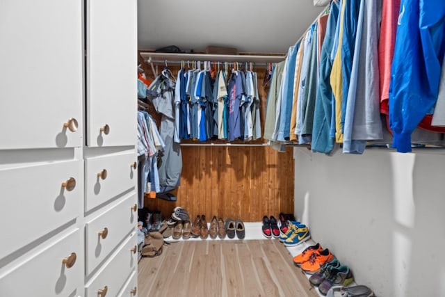 walk in closet featuring light hardwood / wood-style flooring