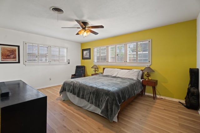 bedroom featuring ceiling fan and light hardwood / wood-style flooring