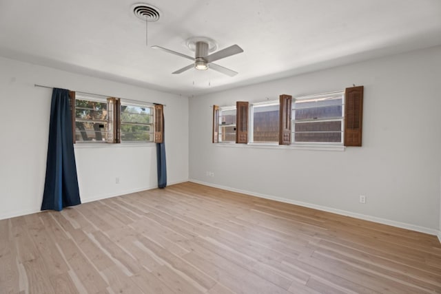 unfurnished room with ceiling fan and light hardwood / wood-style floors