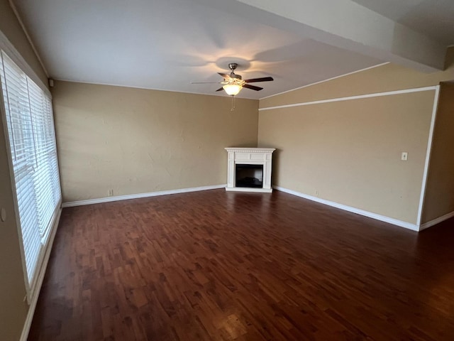 unfurnished living room with dark wood-type flooring and ceiling fan