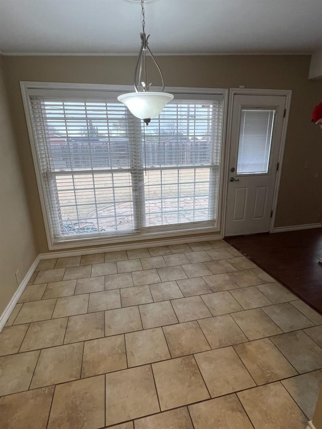 unfurnished dining area with light tile patterned floors