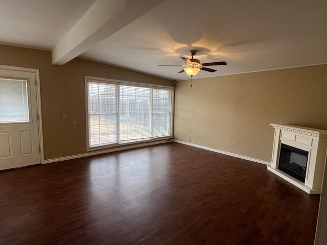 unfurnished living room with ceiling fan, dark wood-type flooring, and beam ceiling