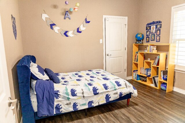 bedroom featuring dark hardwood / wood-style floors