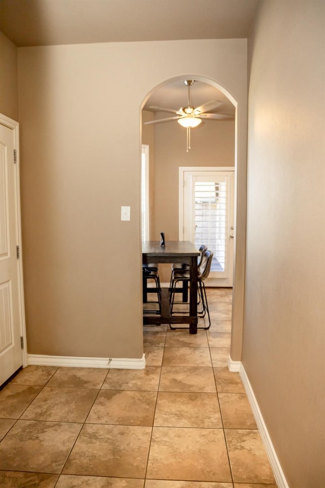 corridor with light tile patterned floors