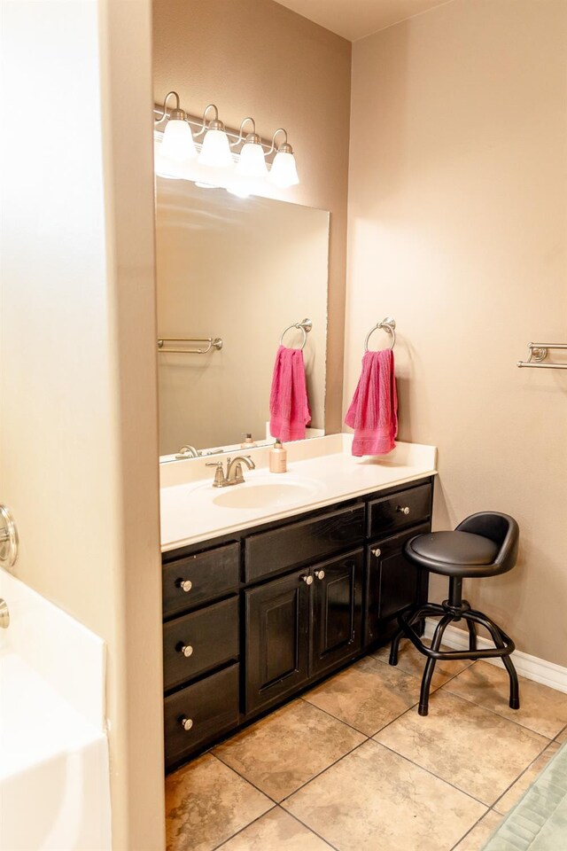 bathroom with vanity and tile patterned floors