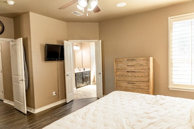 bedroom featuring ceiling fan and dark hardwood / wood-style floors