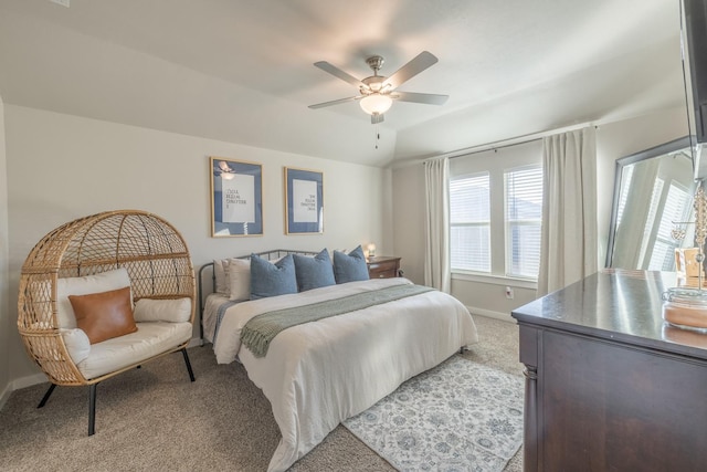 carpeted bedroom featuring lofted ceiling and ceiling fan