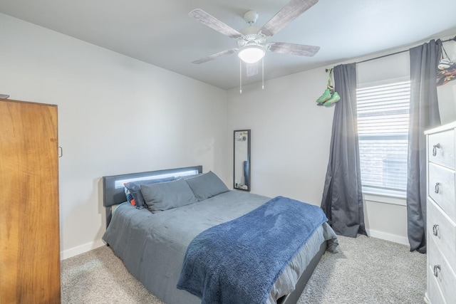 bedroom featuring light carpet and ceiling fan