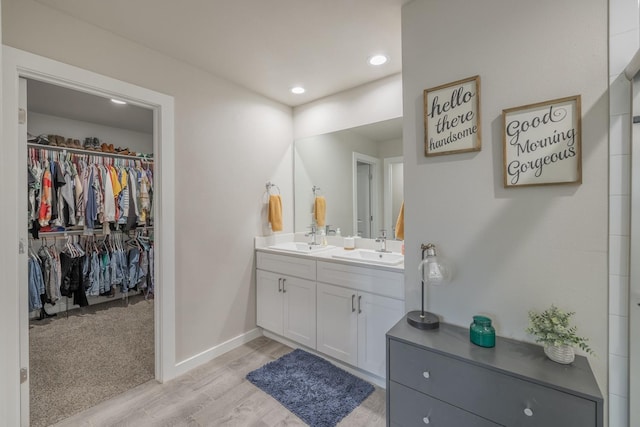 bathroom featuring vanity and hardwood / wood-style floors