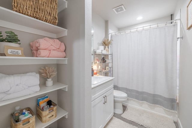 bathroom featuring vanity, toilet, and a shower with shower curtain