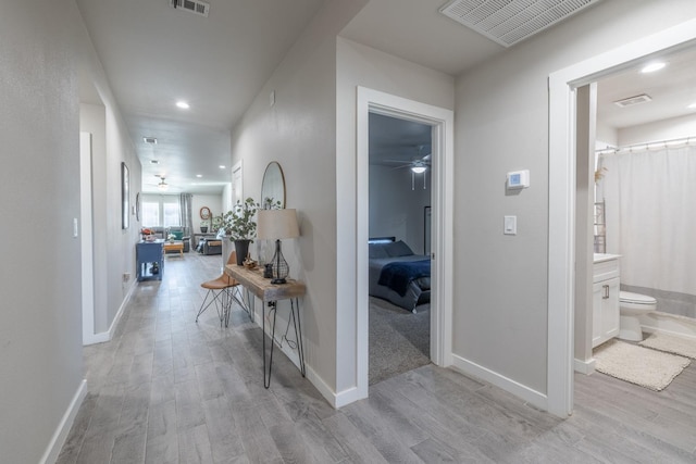 corridor featuring light wood-type flooring