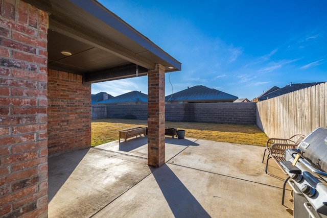 view of patio featuring a grill