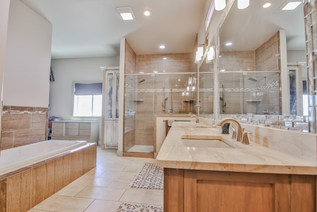 bathroom with plus walk in shower, tile patterned floors, and vanity