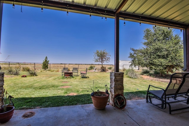 view of yard featuring a patio area and a rural view