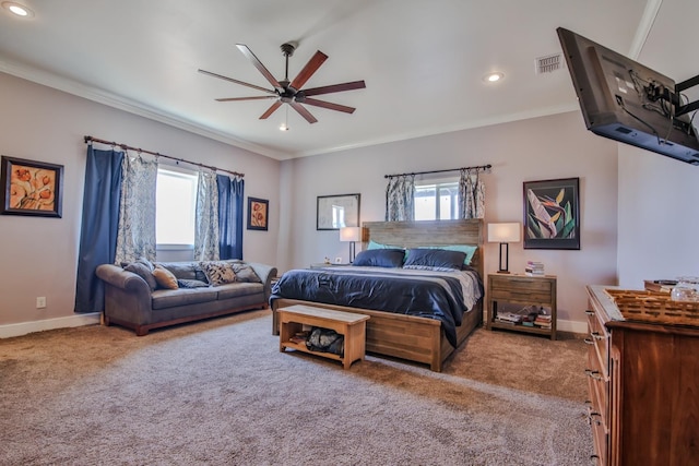 bedroom with multiple windows, ornamental molding, and light colored carpet