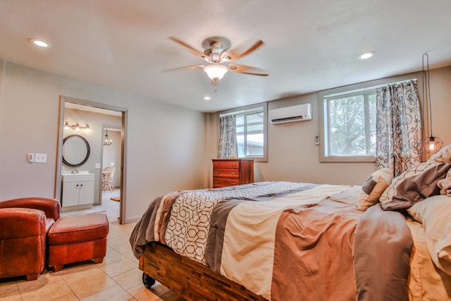 bedroom featuring light tile patterned flooring, sink, a wall mounted AC, and ceiling fan