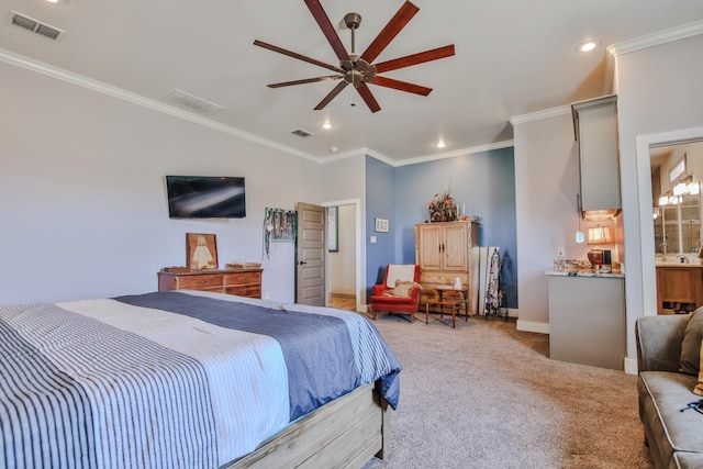 carpeted bedroom featuring ornamental molding, lofted ceiling, ceiling fan, and ensuite bath