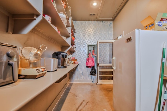 kitchen featuring white fridge