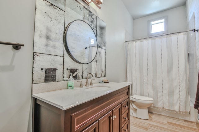 full bathroom with shower / bathtub combination with curtain, vanity, toilet, and wood-type flooring