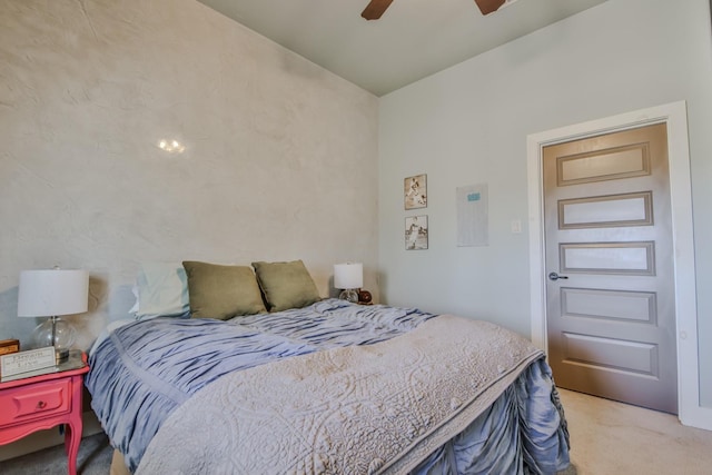 bedroom featuring light carpet and ceiling fan