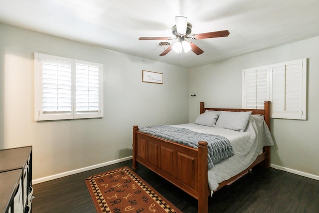 bedroom with dark wood-type flooring and ceiling fan