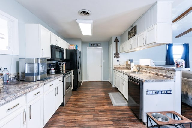 kitchen with white cabinets, dark hardwood / wood-style flooring, sink, and black appliances