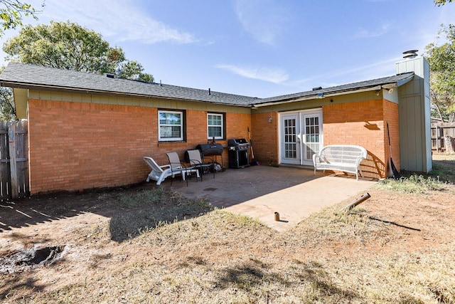 back of house featuring a patio and french doors