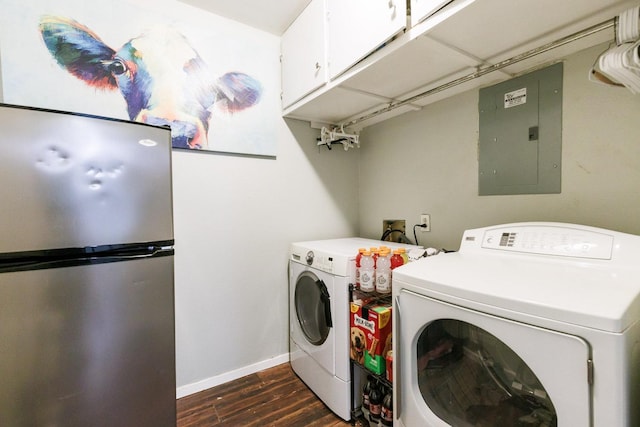 laundry area with cabinets, washing machine and dryer, electric panel, and dark hardwood / wood-style flooring