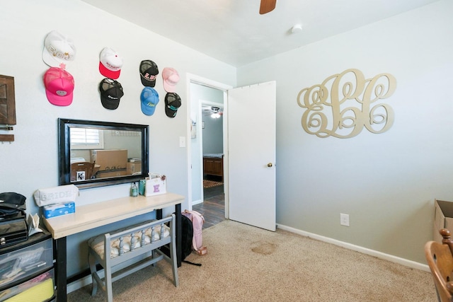 carpeted office with ceiling fan