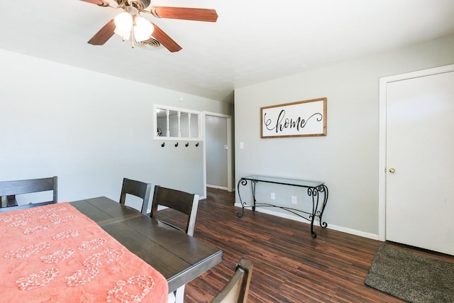 dining space with dark wood-type flooring and ceiling fan