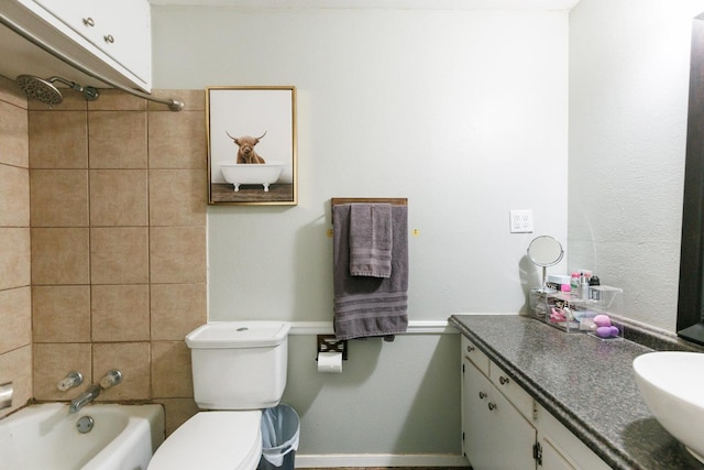 full bathroom with vanity, toilet, and tiled shower / bath