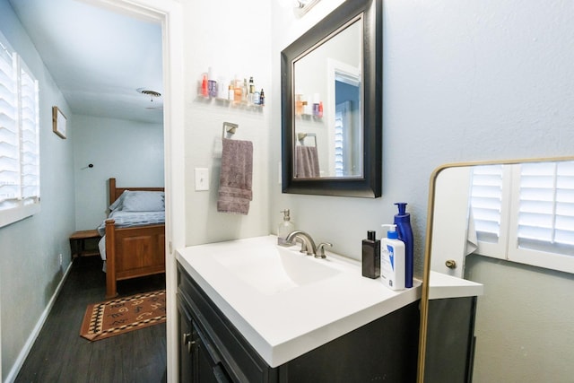 bathroom featuring wood-type flooring and vanity