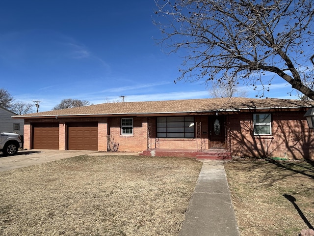 727 E 12th St, Littlefield, TX 79339 - single story home featuring brick siding, an attached garage, concrete driveway, and roof with shingles