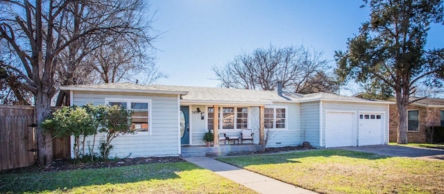 ranch-style house featuring a garage and a front lawn